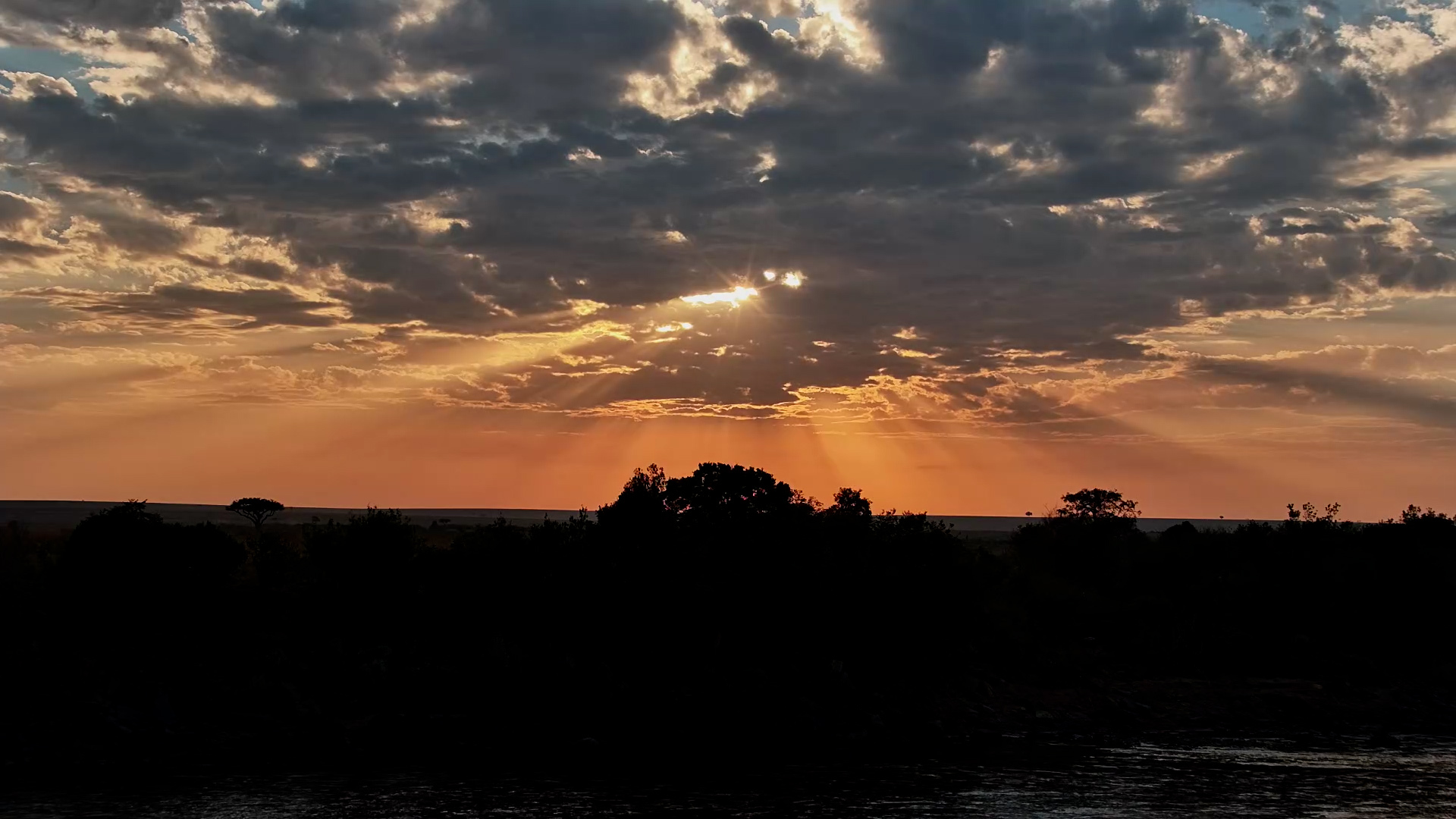 Sunrise Breaks Over the Mara River