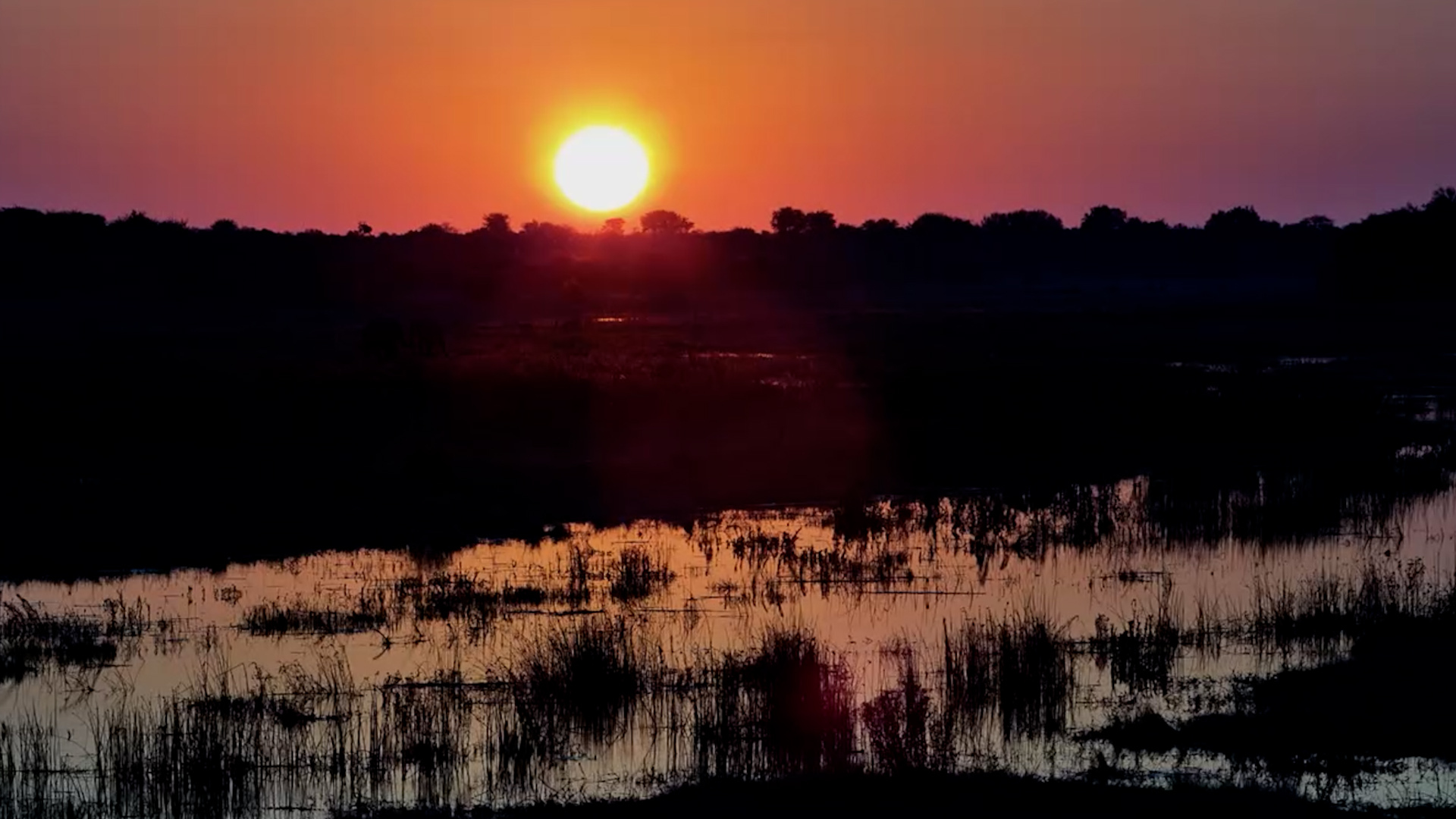 A Dusty Red Sunset Over Moela